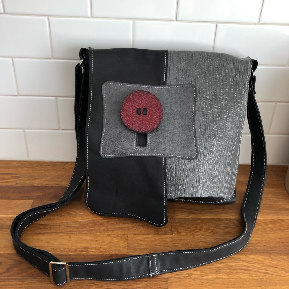 Black and grey leather bag by Capharnaum